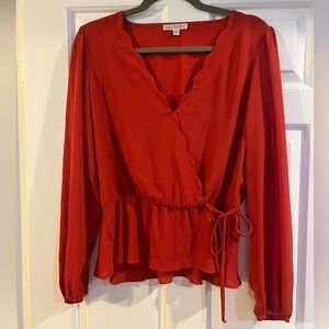 Red scalloped peplum top